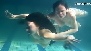 Natural boobs European lesbian swimming with her babe underwater