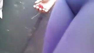 My friend, wearing tight legging, lets me film her in the street